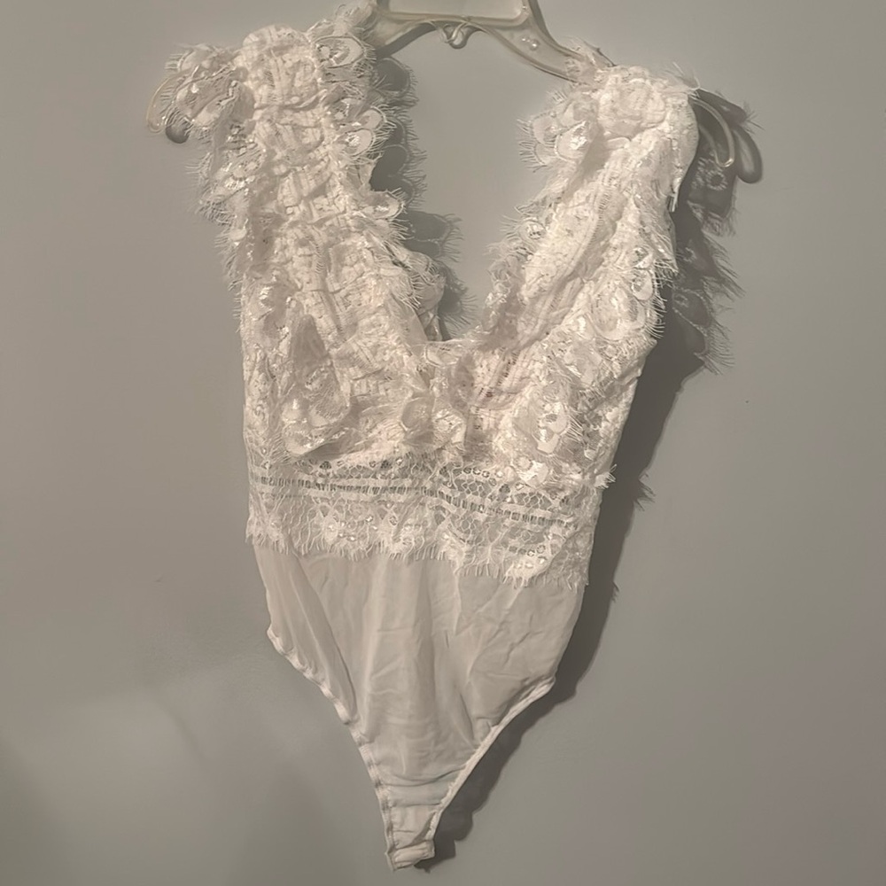 Vici Boutique white bodysuit. Never been worn